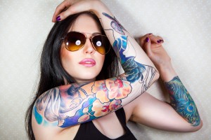 Portrait of a beautiful young woman with a tattoo